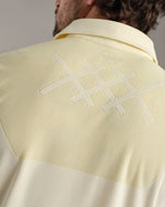 Rhone Men's Cross-Court Polo Shirt - Yellow Dawn